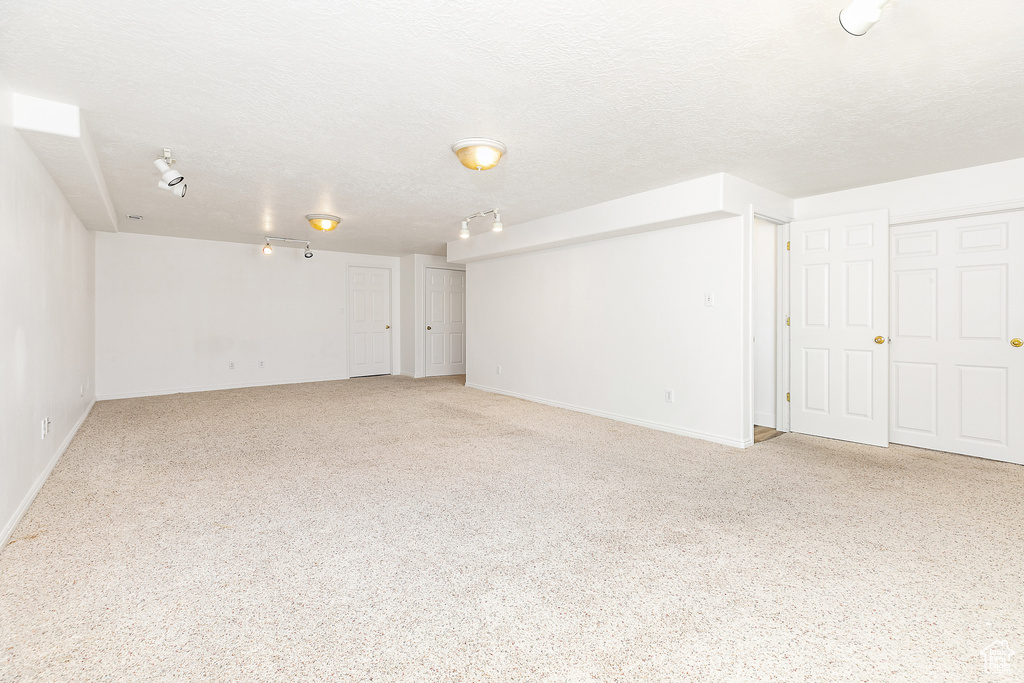 Empty room with a textured ceiling