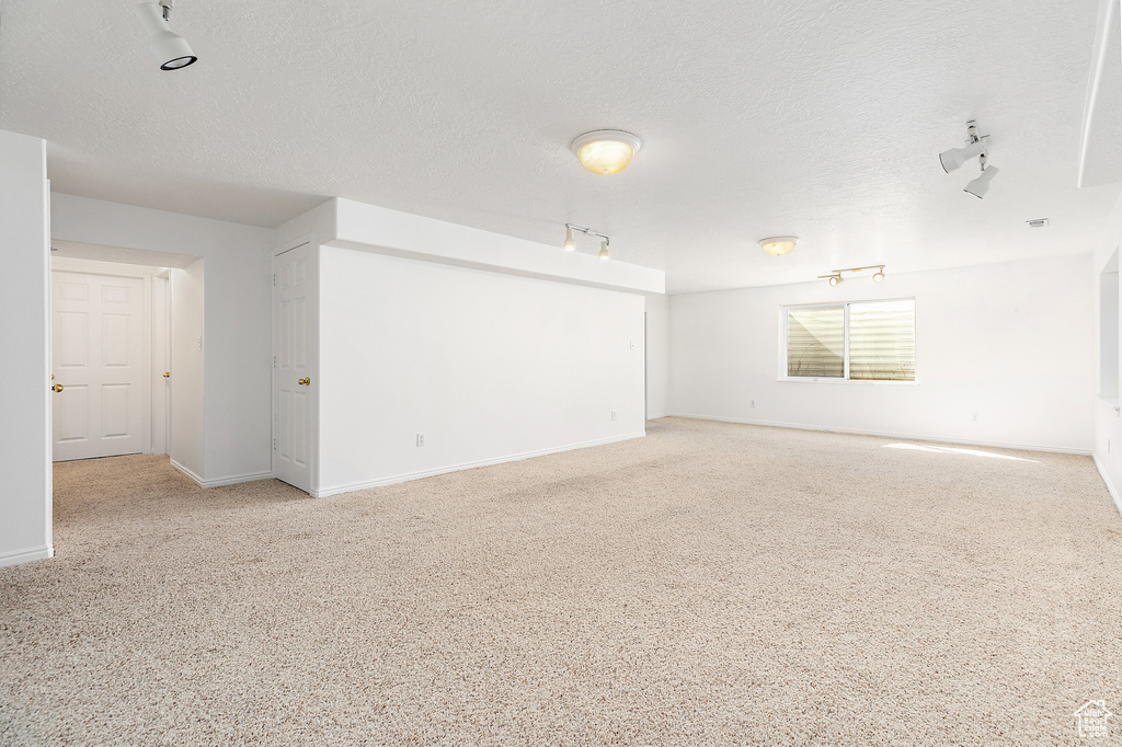 Empty room featuring a textured ceiling