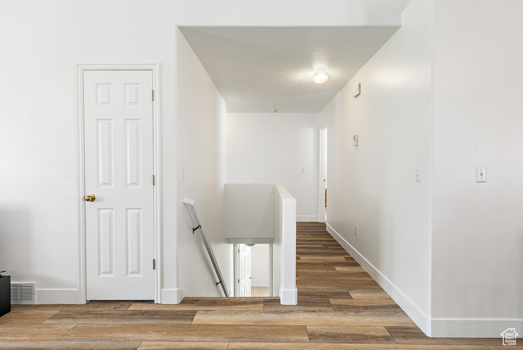 Corridor featuring hardwood / wood-style floors