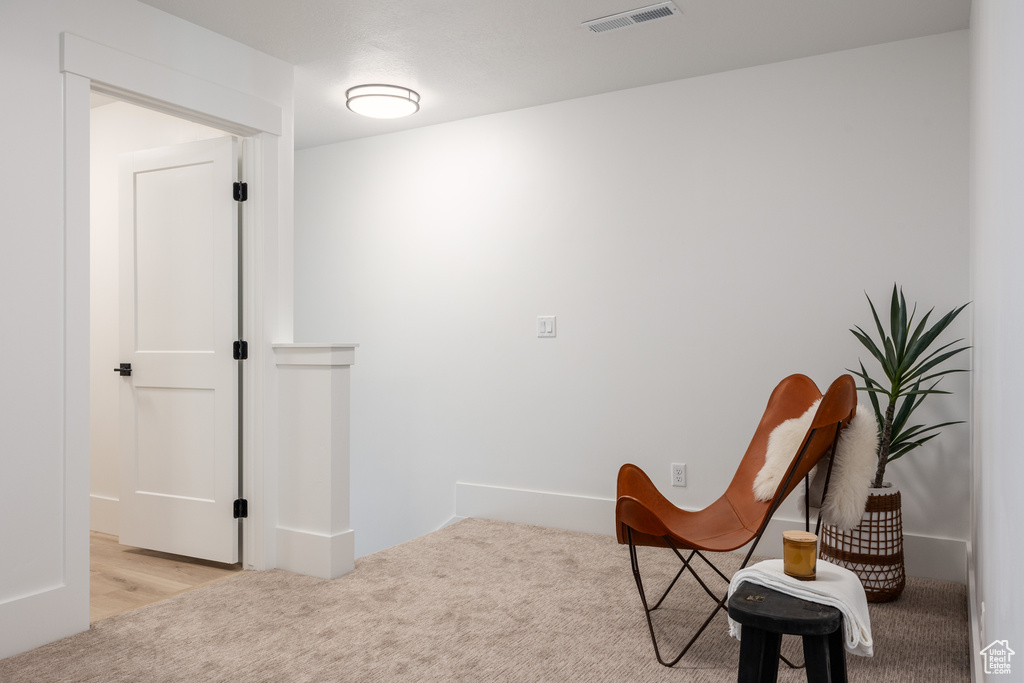 Sitting room with light wood-type flooring