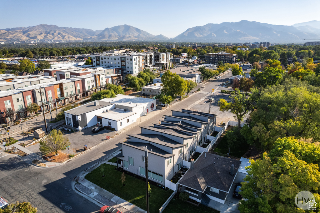 Birds eye view of property with a mountain view