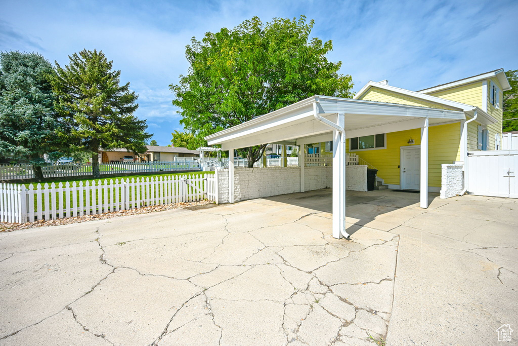 View of patio with a carport