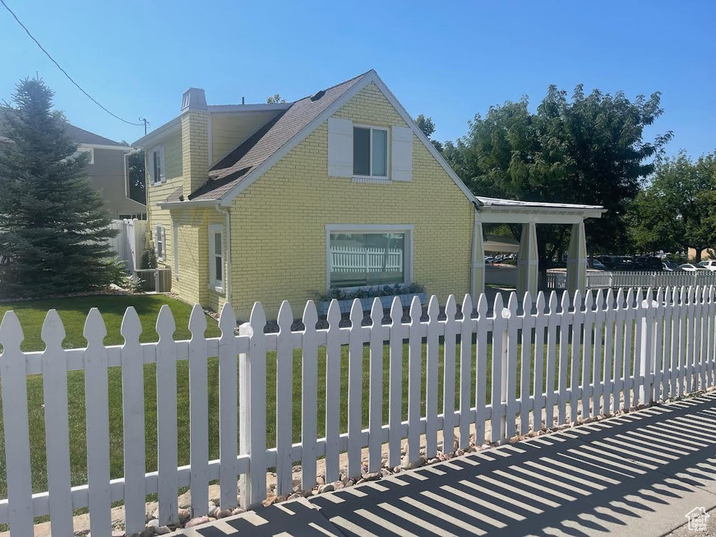 Exterior space featuring a yard