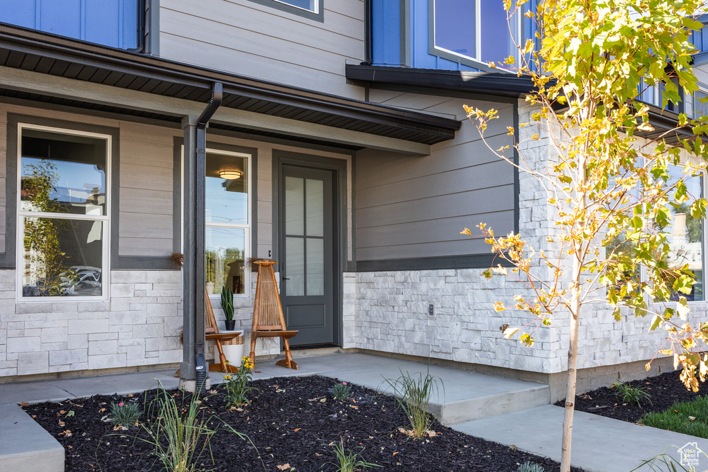 View of exterior entry featuring a porch