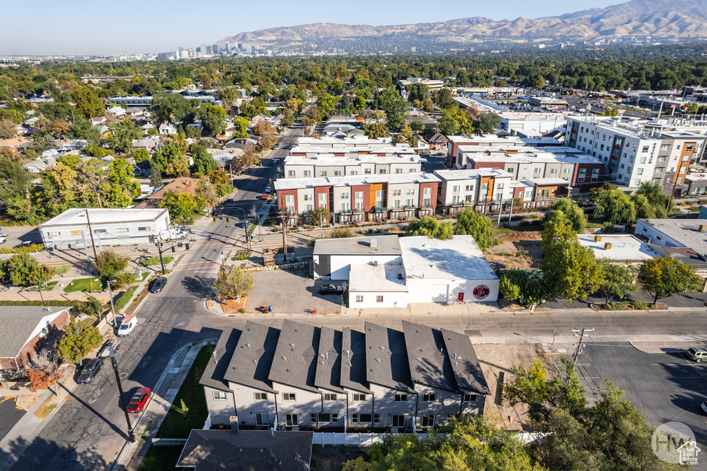 Birds eye view of property with a mountain view