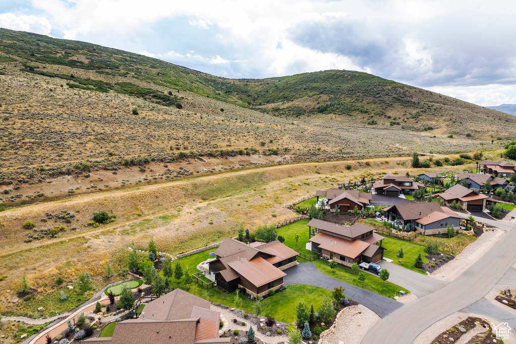 Aerial view of residential area featuring a mountain backdrop