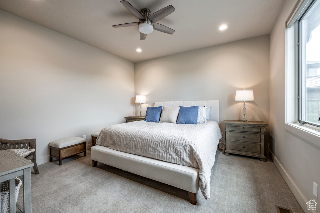 Bedroom featuring carpet flooring, multiple windows, recessed lighting, and baseboards
