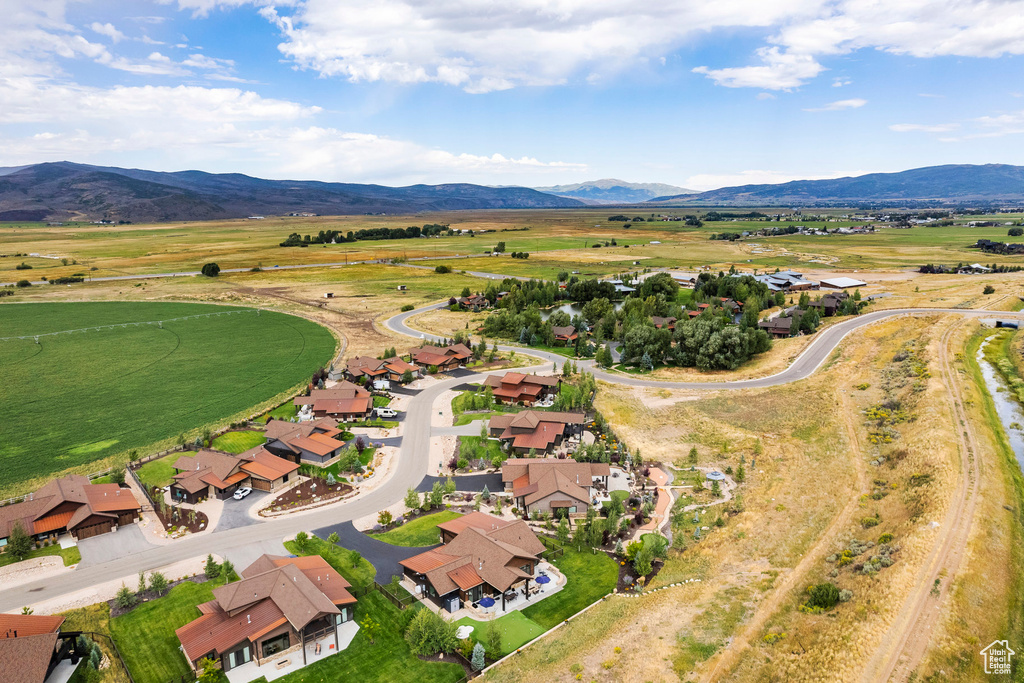 Aerial view of residential area featuring a mountainous background