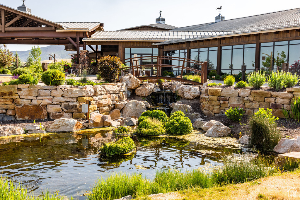 Exterior space with a small pond and a gazebo