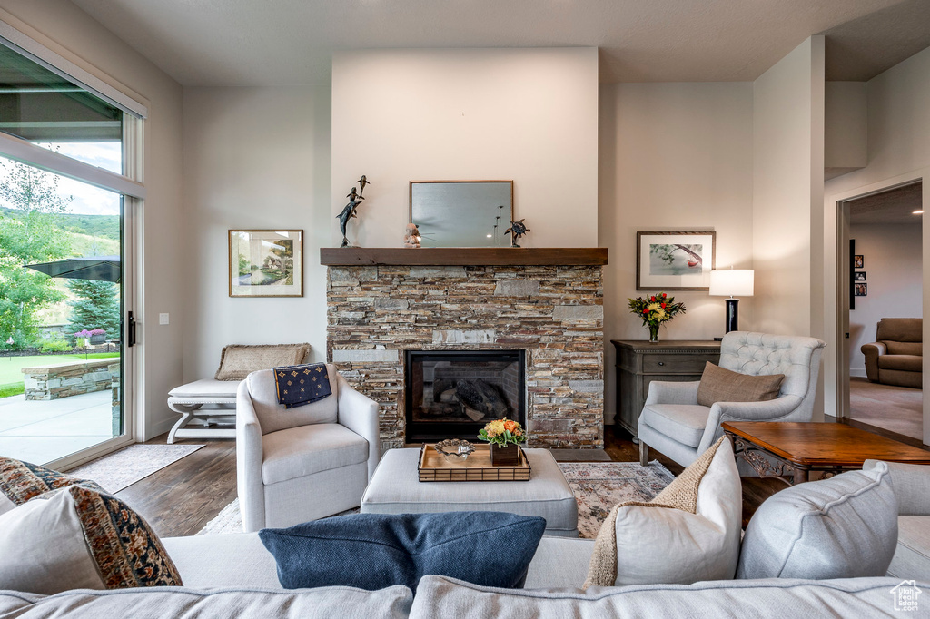 Living area featuring wood finished floors and a fireplace