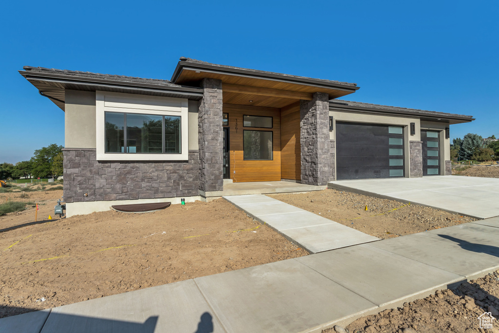 Prairie-style home featuring a garage