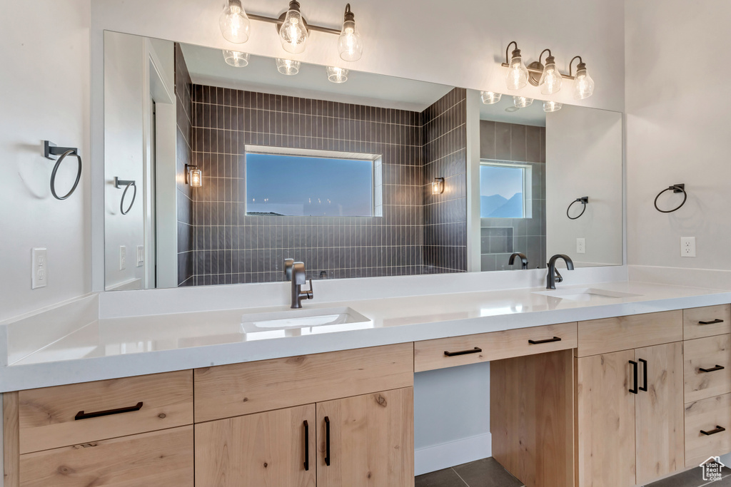 Bathroom featuring vanity and tile patterned floors