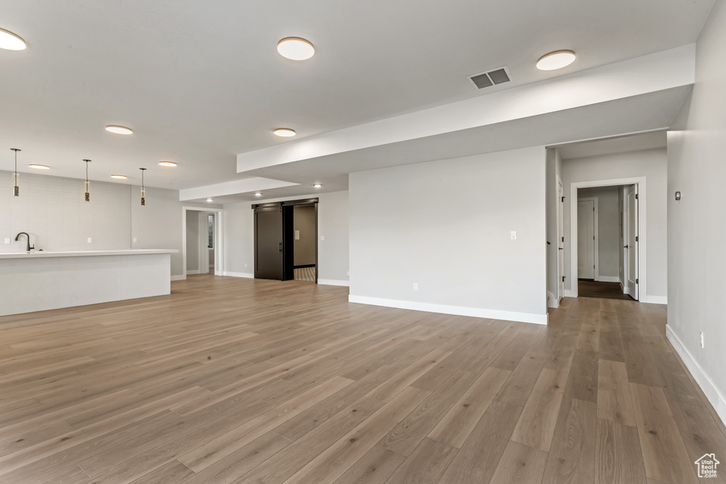 Interior space with sink and hardwood / wood-style flooring