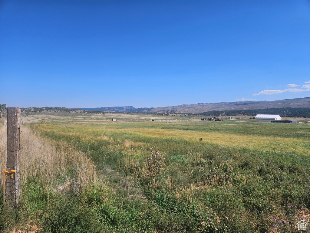 Property view of mountains featuring a rural view