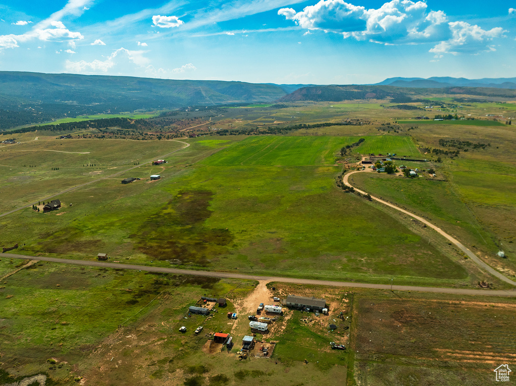 Birds eye view of property featuring a mountain view and a rural view