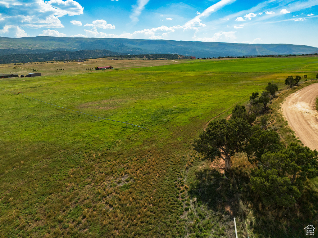 Birds eye view of property featuring a mountain view and a rural view