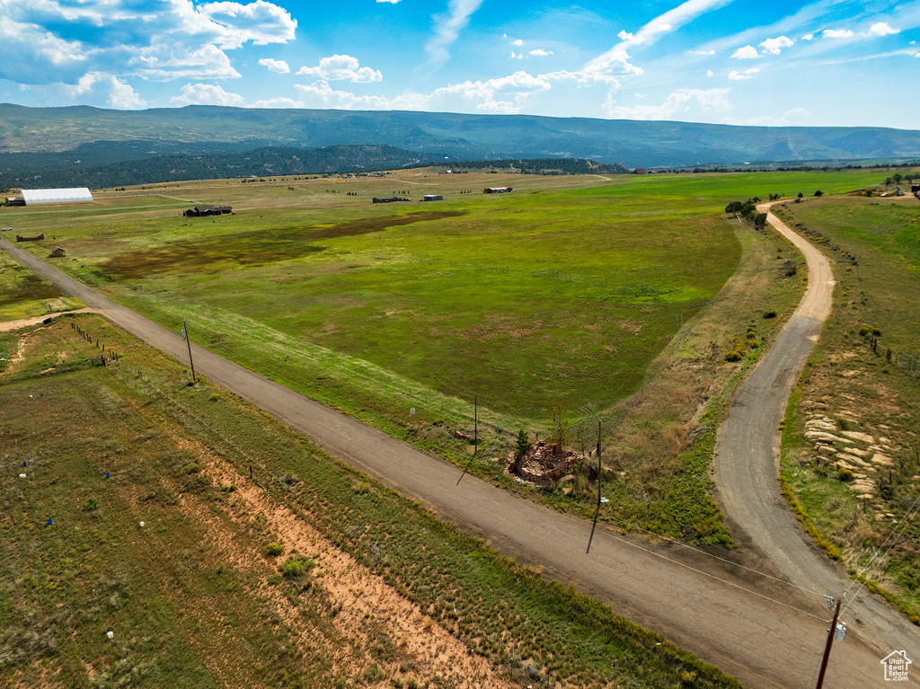 Birds eye view of property with a mountain view and a rural view