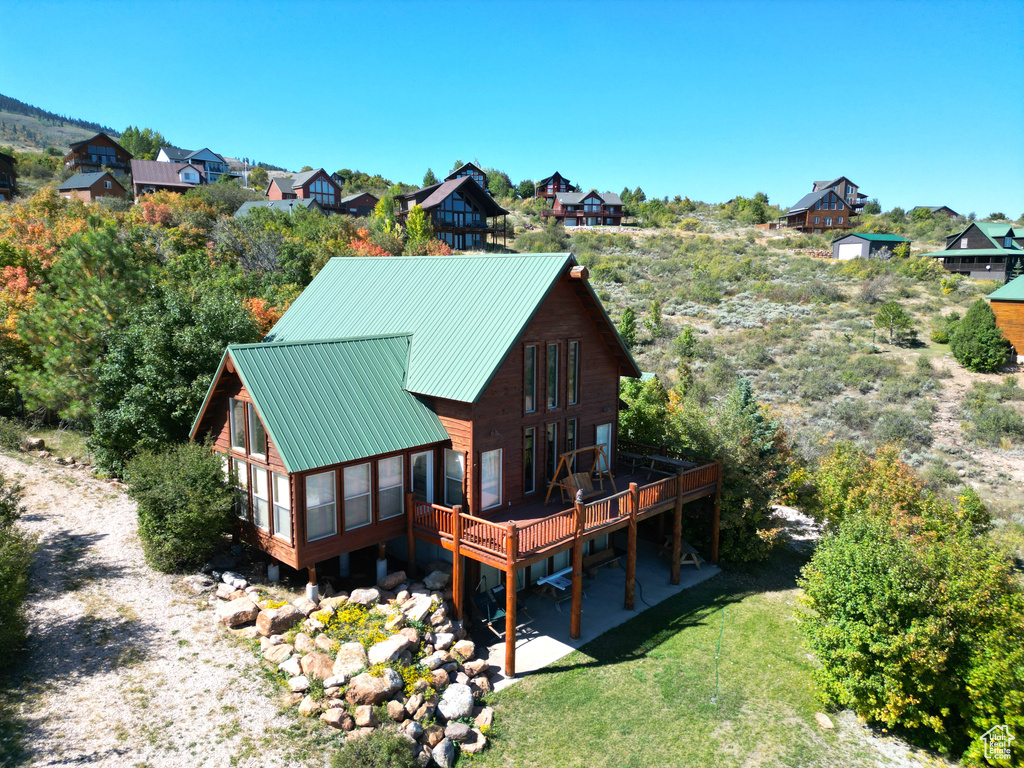 Rear view of house with a deck