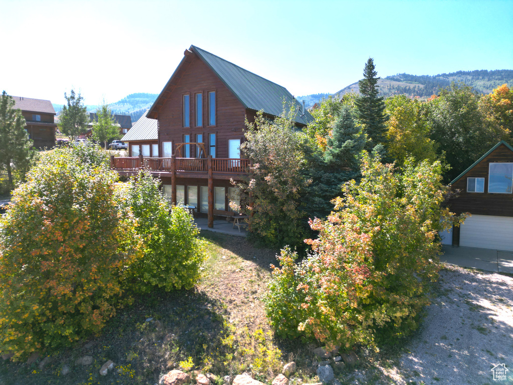 Exterior space featuring a mountain view and a garage