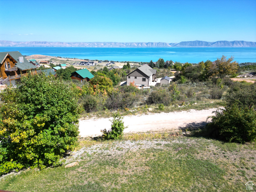 Drone / aerial view with a water and mountain view