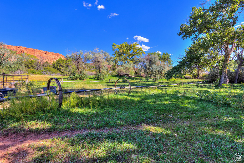 View of yard featuring a view of rural / pastoral area and a mountain view