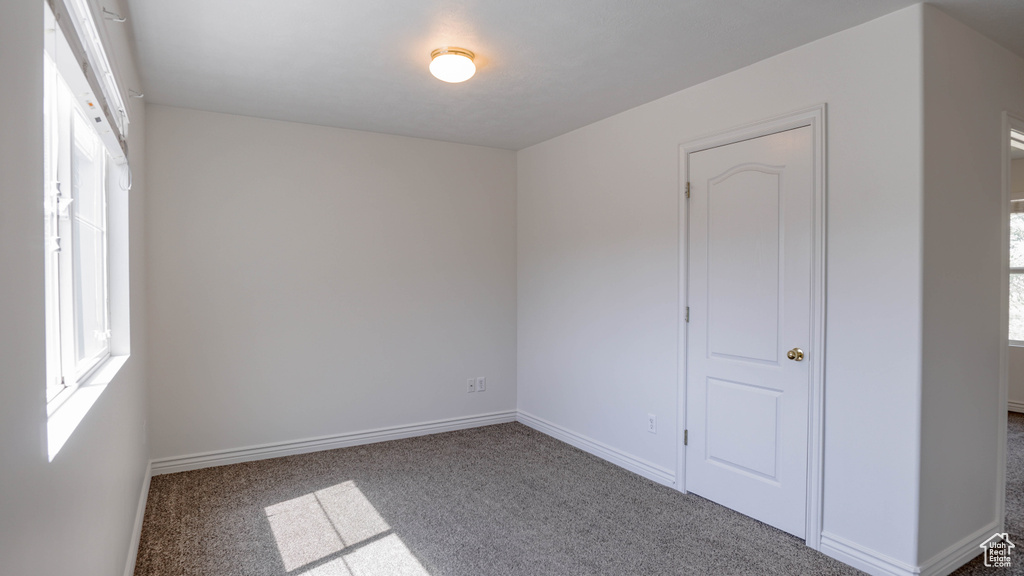 Unfurnished bedroom with carpet floors