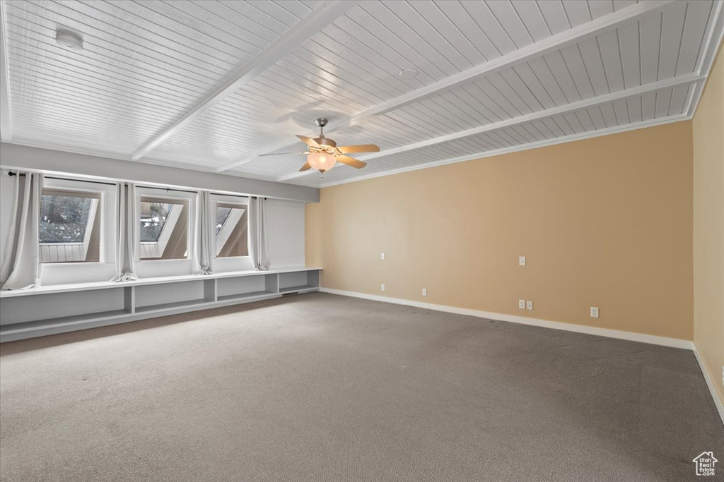 Unfurnished room with a ceiling fan, carpet, and baseboards