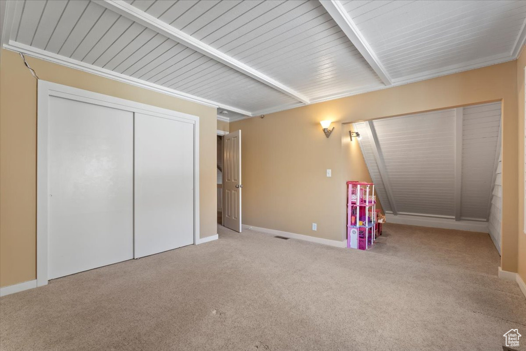 Game room with baseboards, carpet flooring, and beamed ceiling