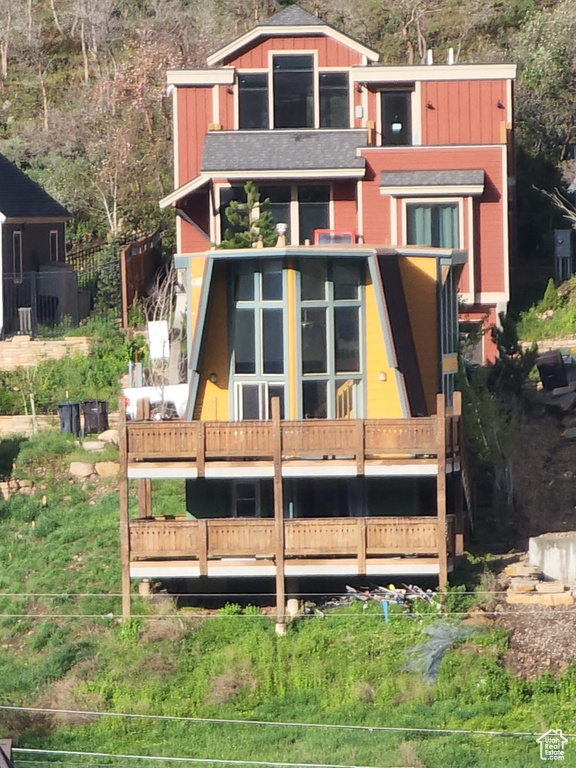 Rear view of house with a sunroom