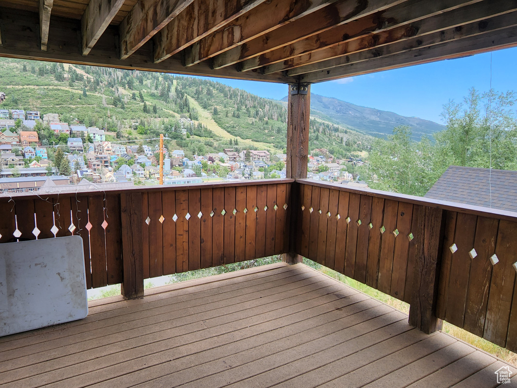 Wooden terrace featuring a mountain view