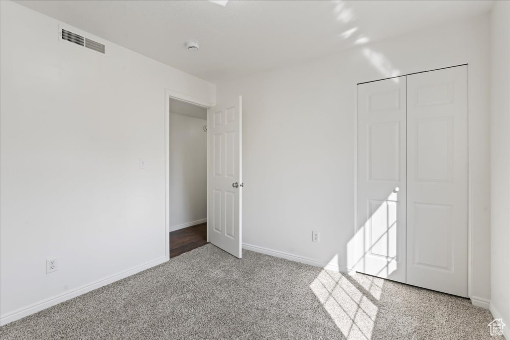 Unfurnished bedroom featuring a closet