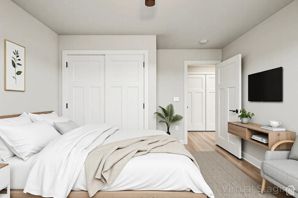 Bedroom featuring a closet, light wood finished floors, and baseboards