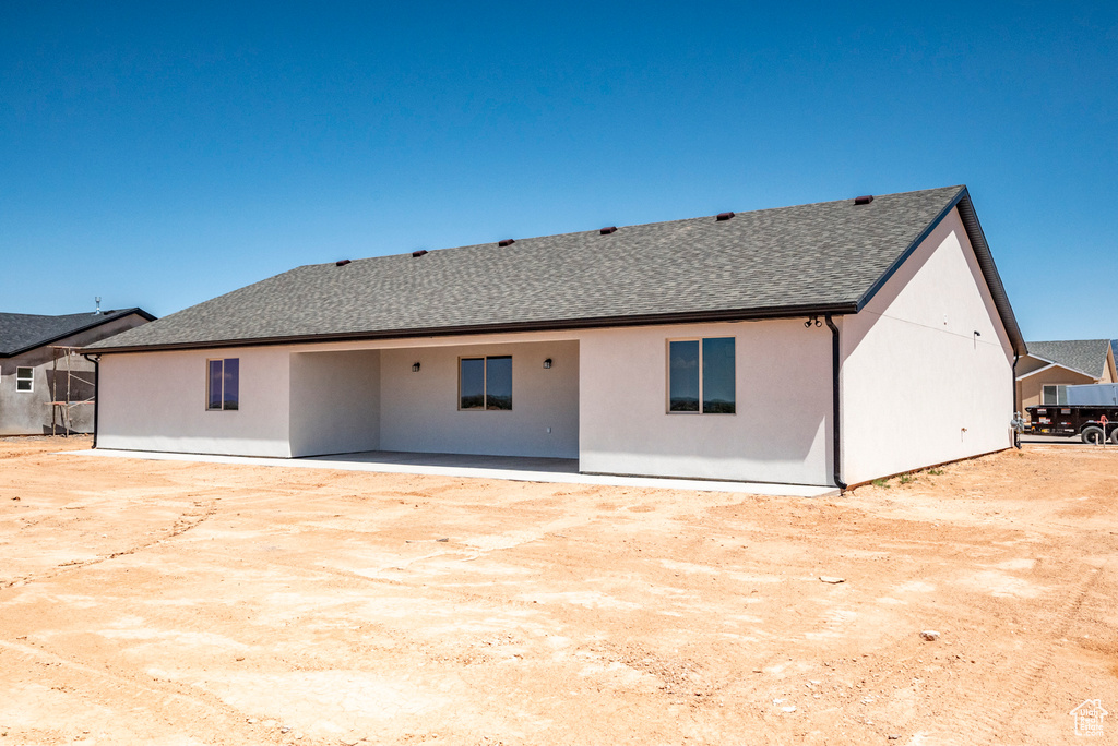 Rear view of property with a patio area