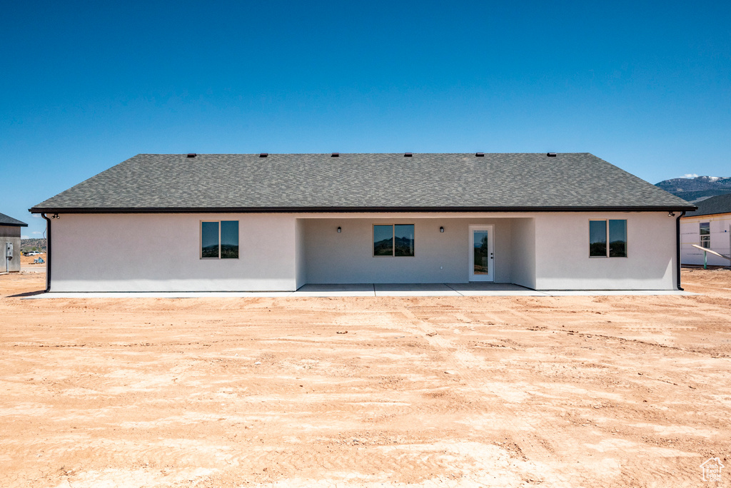 Rear view of property with a patio