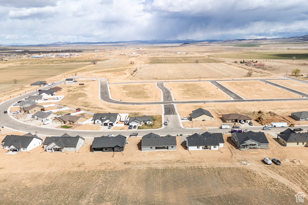 Birds eye view of property featuring a mountain view and a residential view
