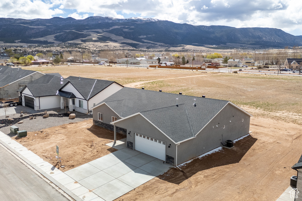 Birds eye view of property with a mountain view