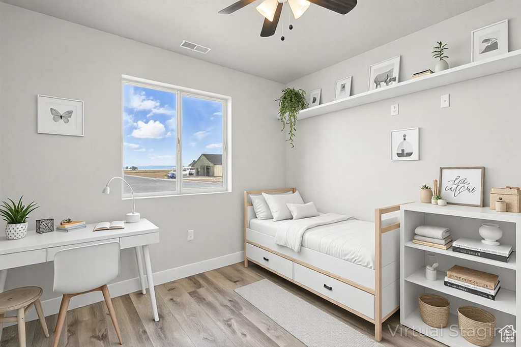 Bedroom with visible vents, baseboards, and light wood-style flooring