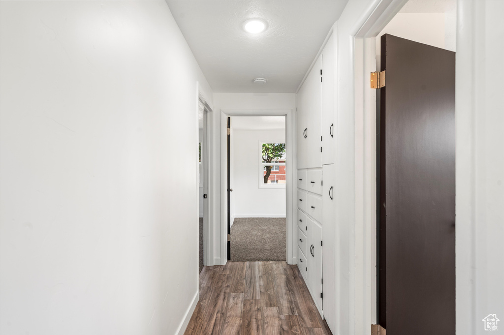 Corridor featuring hardwood / wood-style floors