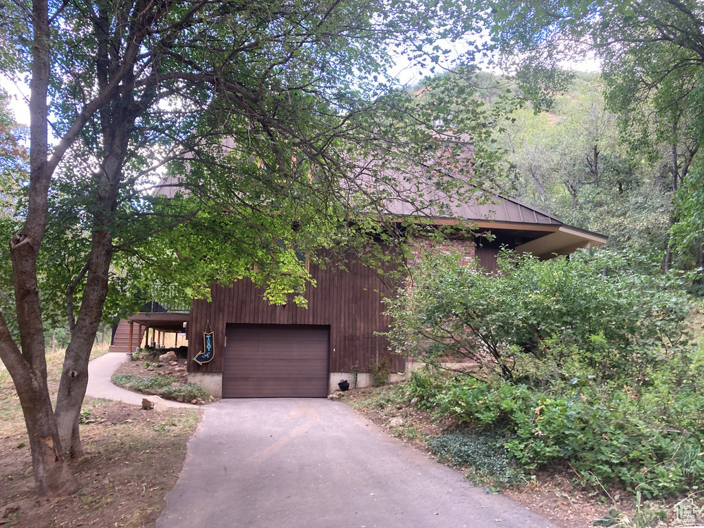 View of front facade featuring a garage