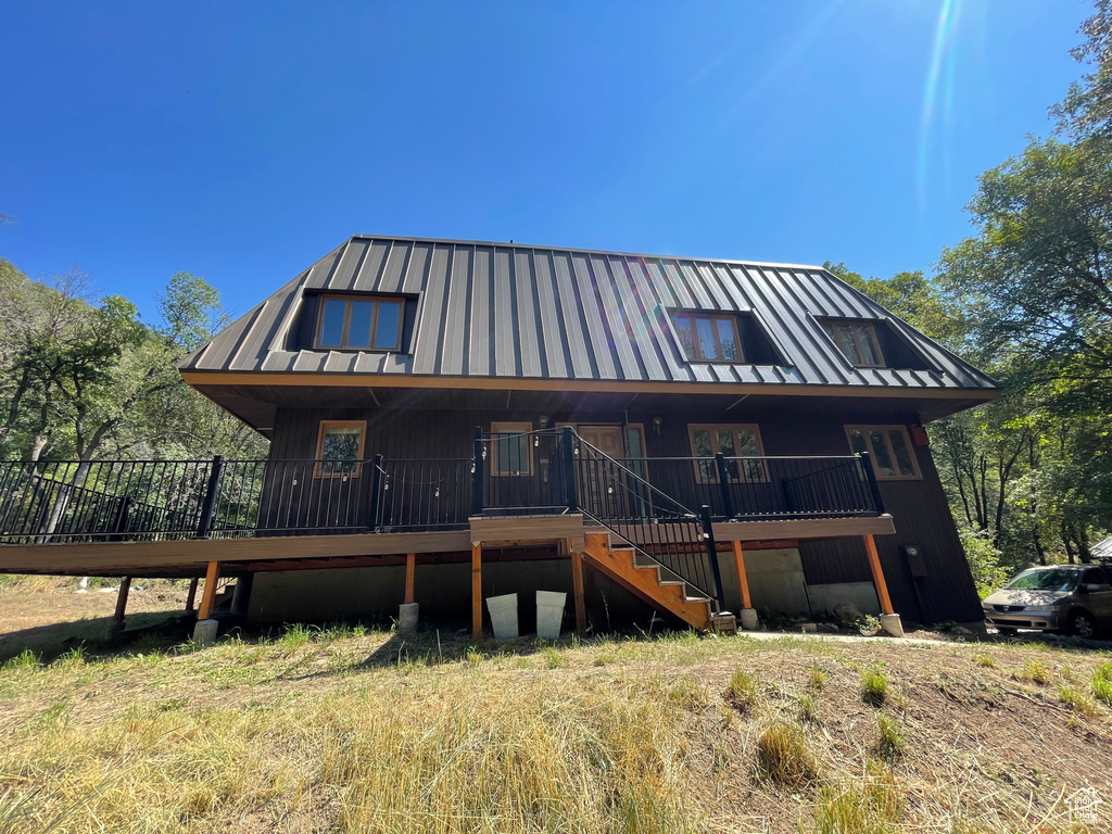 Back of house featuring a deck