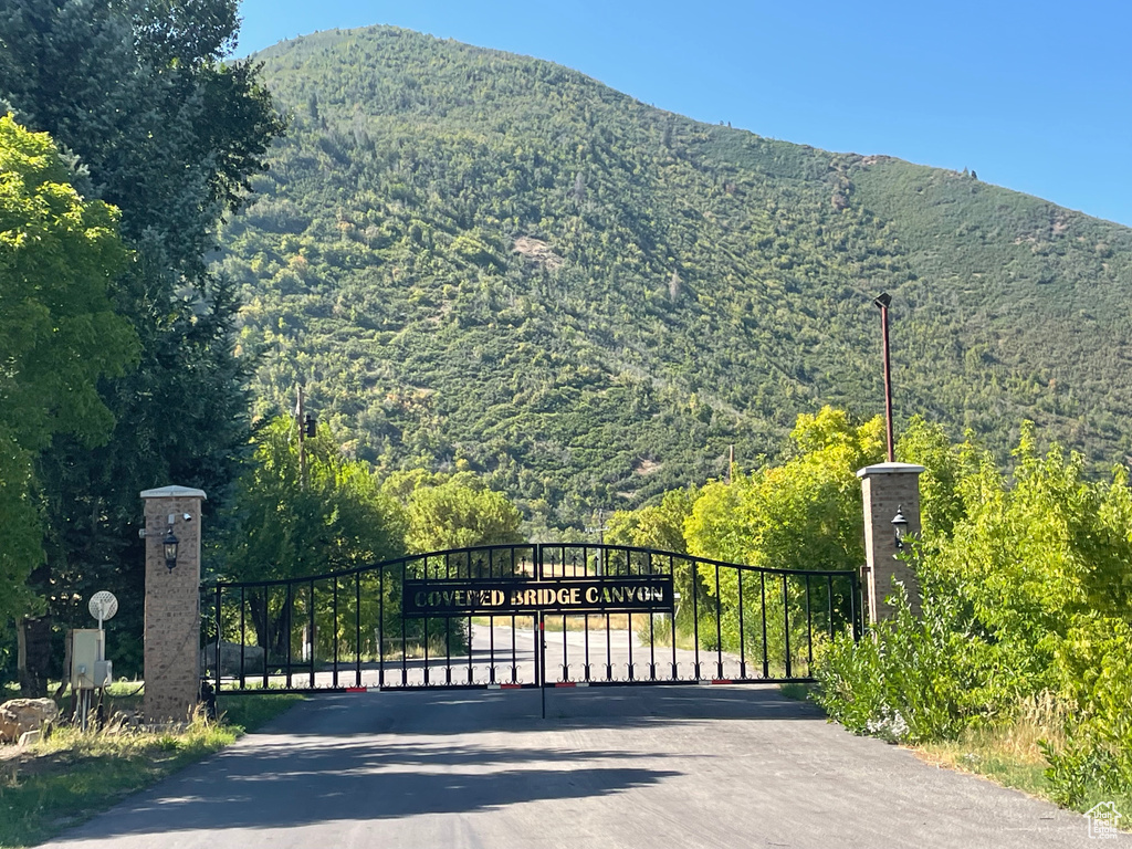 View of gate featuring a mountain view