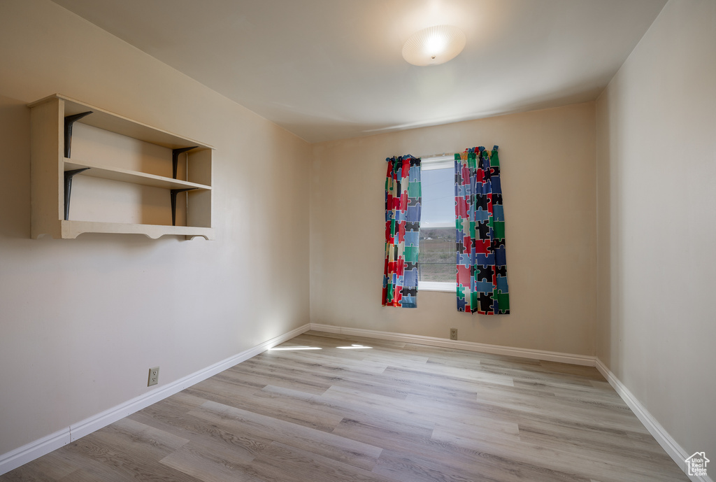 Spare room with light hardwood / wood-style floors