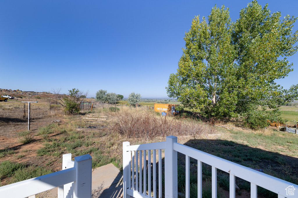 View of yard with a rural view