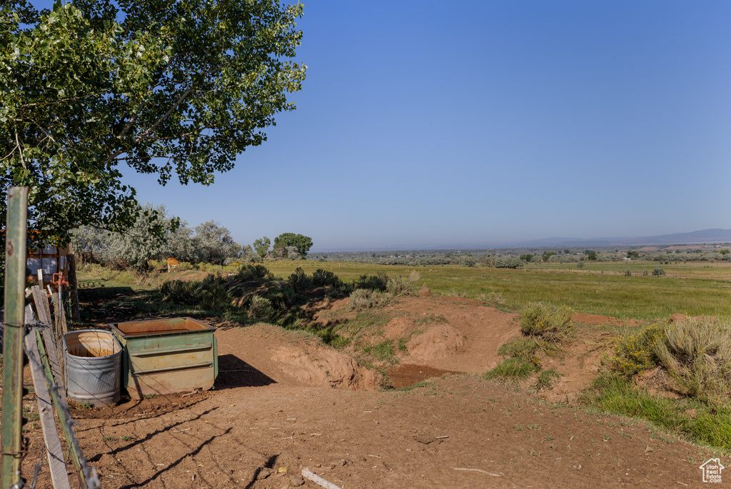 View of yard with a rural view
