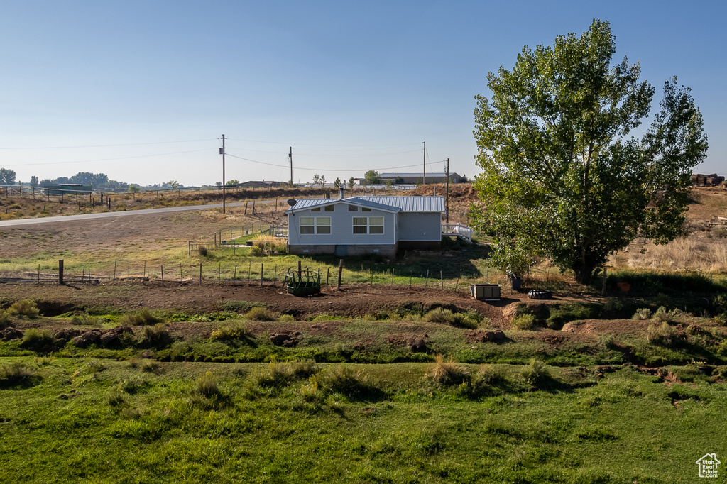 View of yard with a rural view