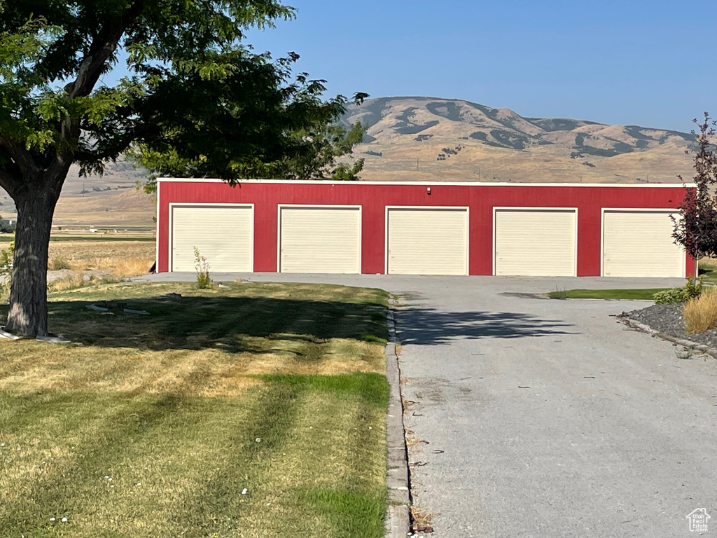 Exterior space with a mountain view and a yard