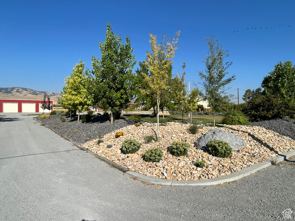 View of front facade with a mountain view and a garage