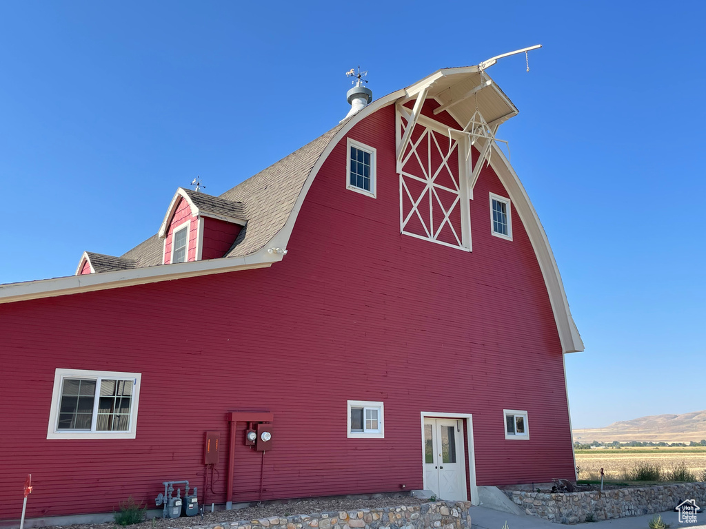 View of property exterior featuring a mountain view