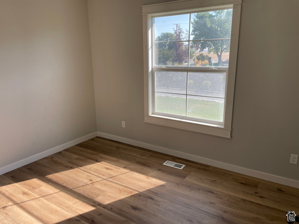 Empty room featuring light hardwood / wood-style floors