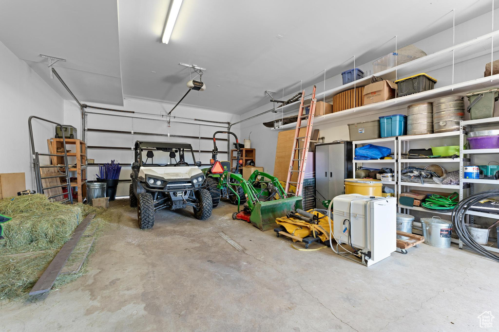 Garage featuring a garage door opener